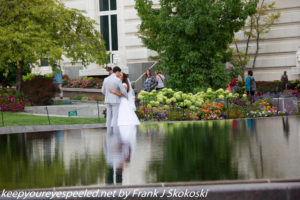 Couple posing for wedding photographs Temple Square