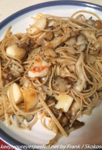 dinner meal of shrimp, scallops, hen of woods mushrooms over pasta 
