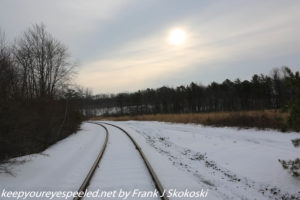snow covered railroad tracks 