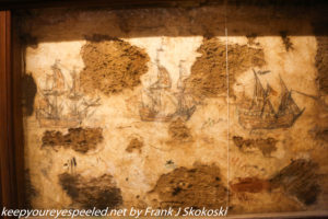 drawings of ships on dungeon walls. 
