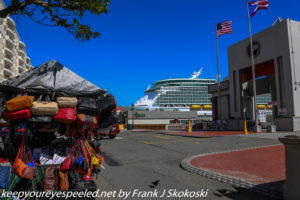 street vendor and cruise ship in background 