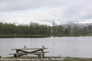 snow capped moutnains on lake 