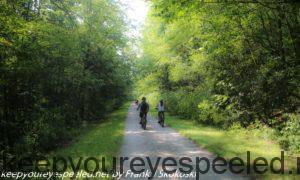 bikers on tree lined trail 