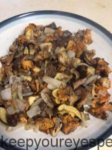 wild mushrooms sauted with onions in olive oil 